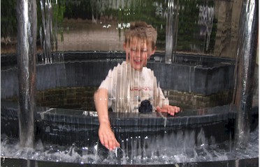 Tom plays in a water feature at Alnwick Castle Tom plays in a water feature at Alnwick Castle